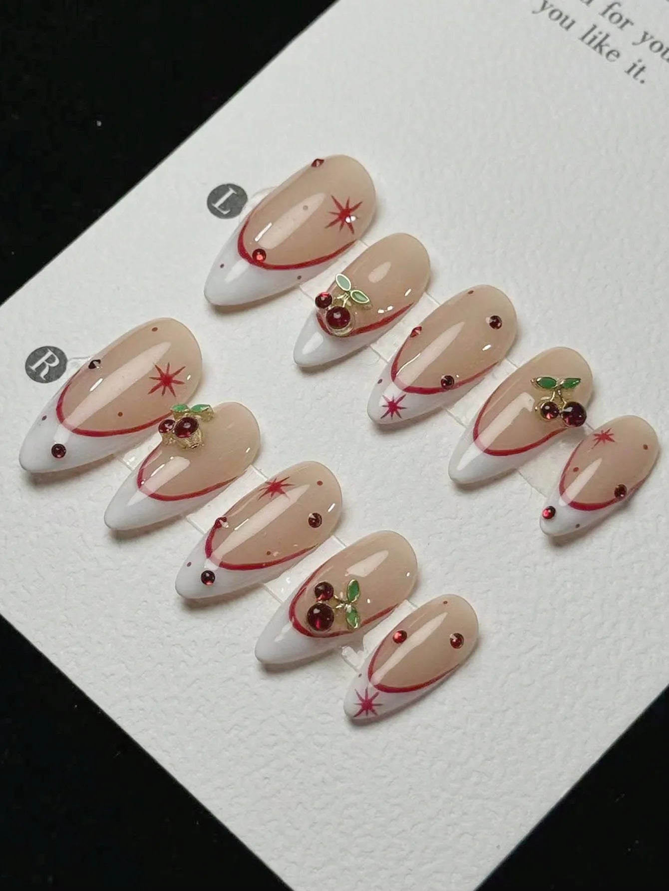 10 pieces of pure handmade almond-shaped nails, with white French tips and red cherry decorations. They are suitable for daily c