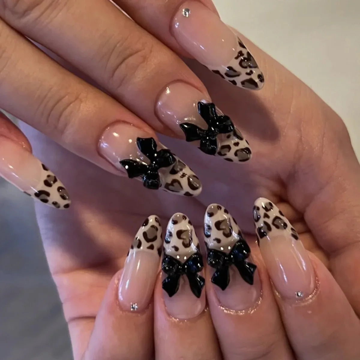 24Pcs Leopard Print Fake Nails Black Bow Press on Long Almond with Rhinestone False Nails Wearable Finished Fingernails Nail Art