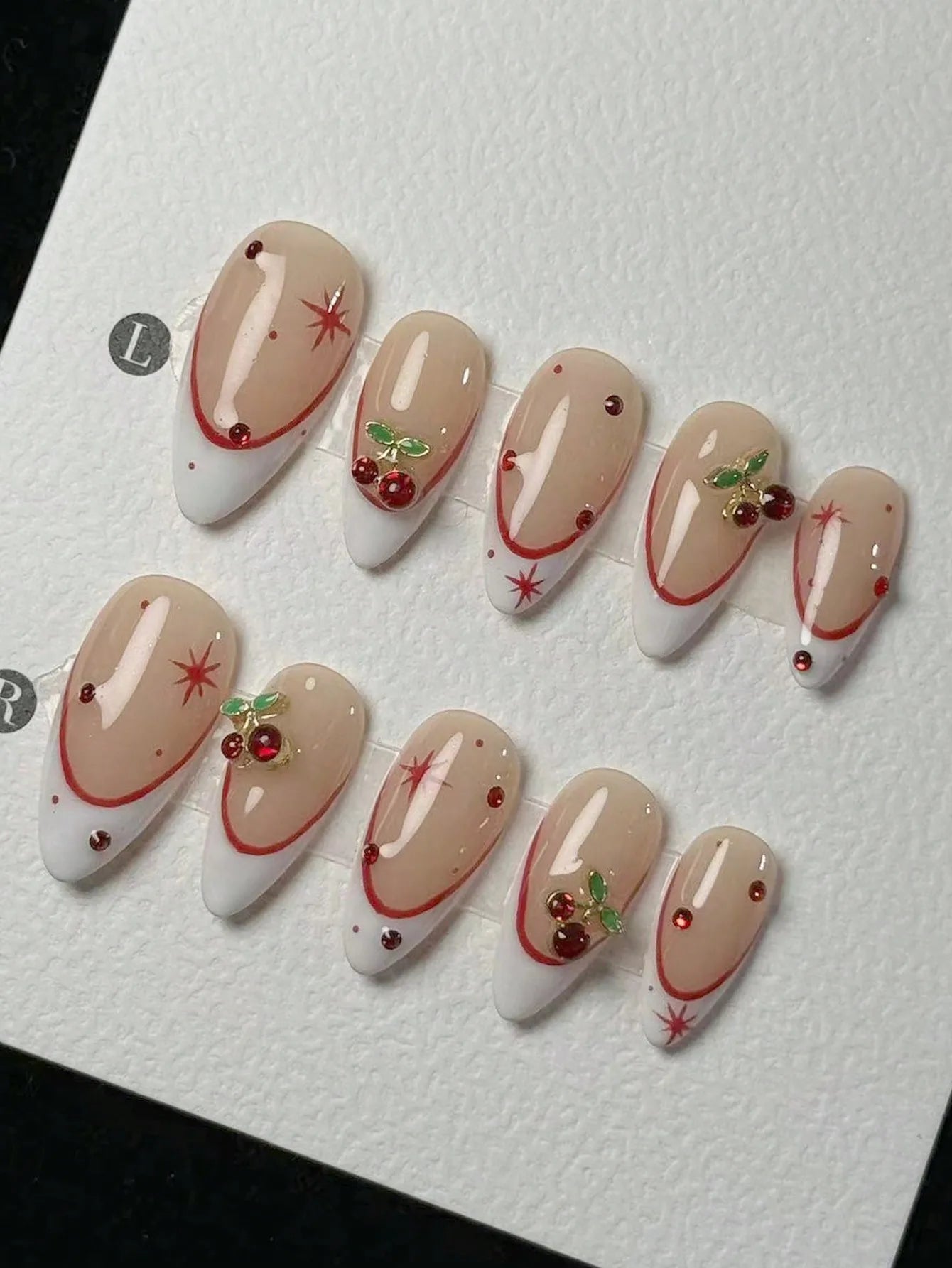 10 pieces of pure handmade almond-shaped nails, with white French tips and red cherry decorations. They are suitable for daily c